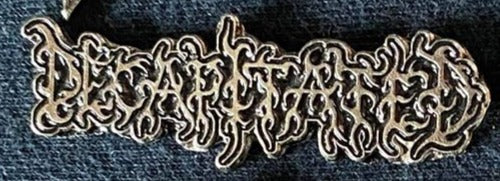 Decapitated Metal Badge